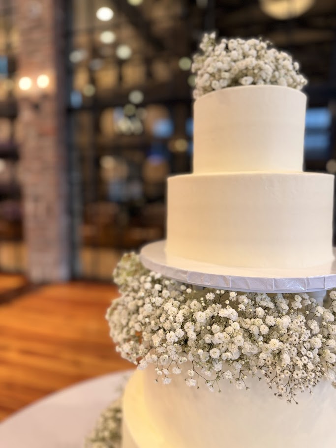 Reception flowers and cake at Lake Charles wedding