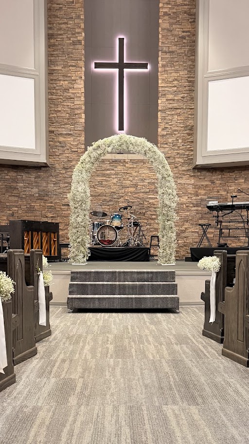 Floral arch with cross inside The Flower Shop
