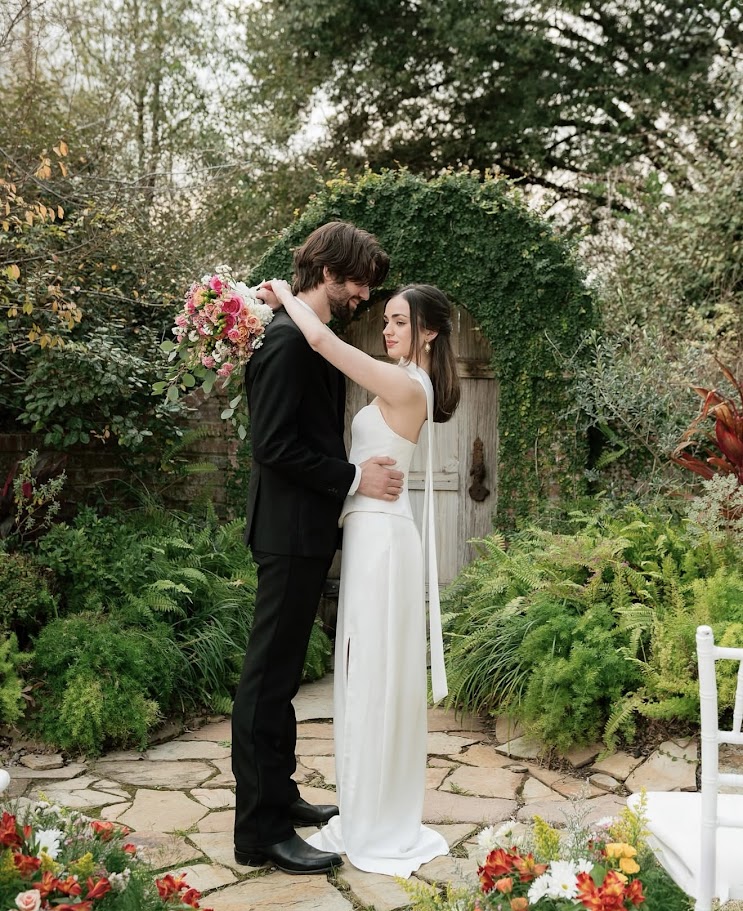 Bride and groom with bouquet at Lake Charles wedding